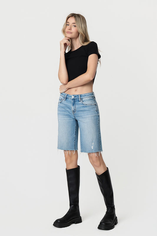 Mid Rise Raw Hem Medium Wash Shorts